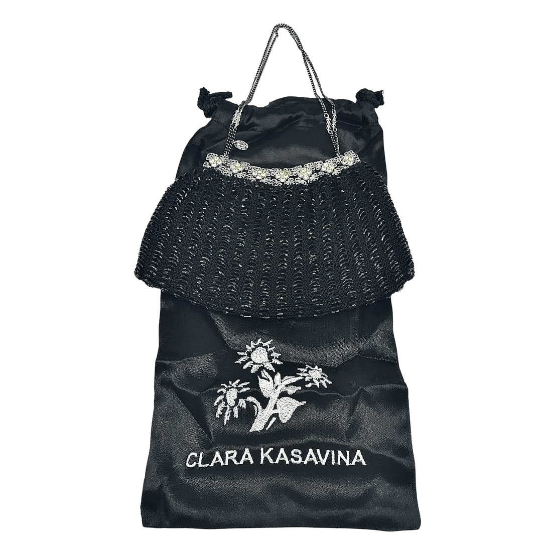 Clara Kasavina selling black clutch